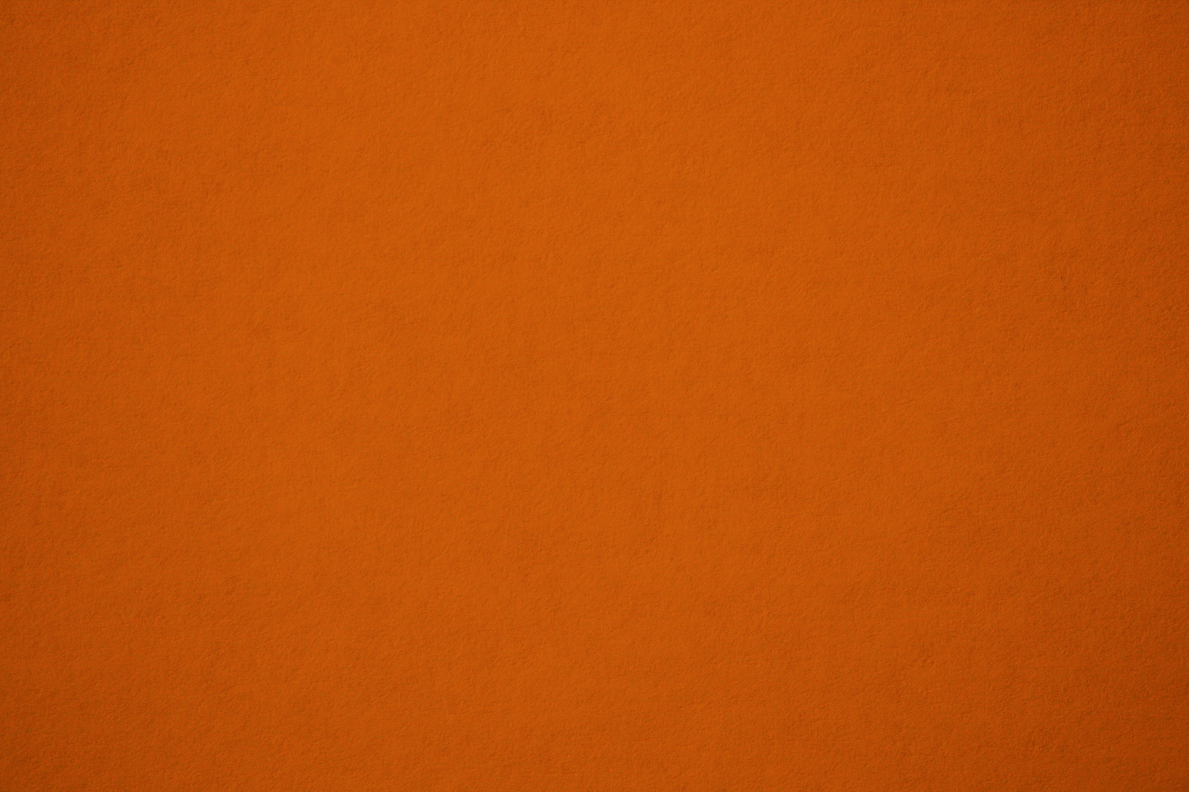 Темный оранжево желтый цвет. Оранжевый однотонный. Оранжевая фактура. Оранжевая текстура. Оранжевый фон.